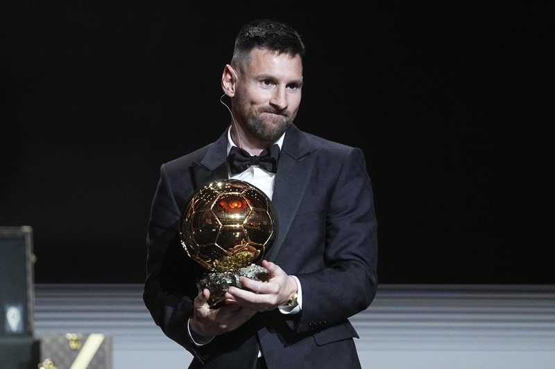 APTOPIX France Soccer Golden Ball Award Inter Miami's and Argentina's national team player Lionel Messi receives the 2023 Ballon d'Or trophy during the 67th Ballon d'Or (Golden Ball) award ceremony at Theatre du Chatelet in Paris, France, Monday, Oct. 30, 2023. (AP Photo/Michel Euler)