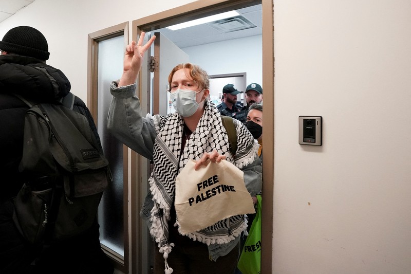 Supporters of Palestinian rights, calling for a ceasefire and end to the siege in Gaza, occupy the constituent office of Canada's Deputy Prime Minister and Finance Minister Chrystia Freeland in Toronto, Ontario, Canada October 30, 2023. REUTERS/Arlyn McAdorey