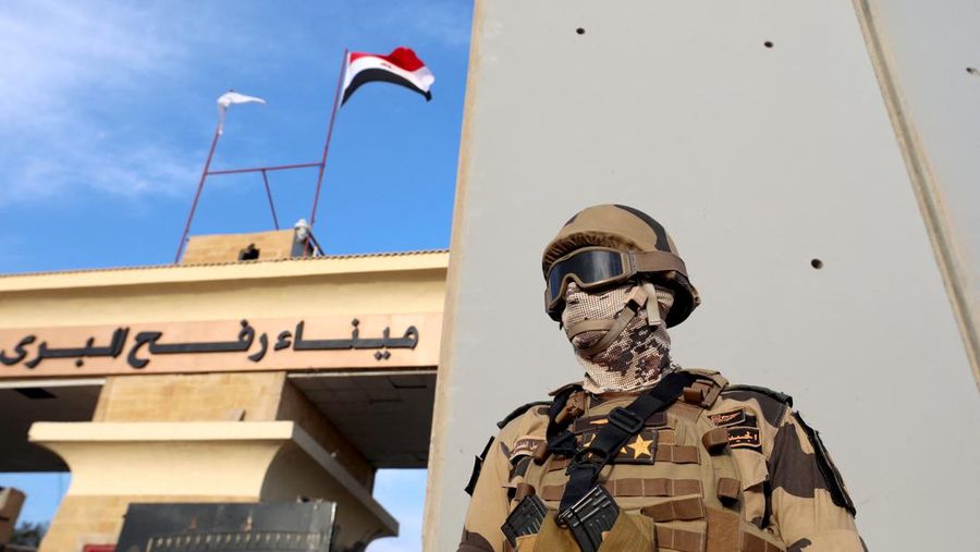 Military personnel stand guard on the day of Egyptian Prime Minister Mostafa Madbouly's visit to the Rafah border crossing between Egypt and the Gaza Strip, amid the ongoing conflict between Israel and Palestinian Islamist group Hamas, in Rafah, Egypt, October 31, 2023. REUTERS/Mohamed Abd El Ghany