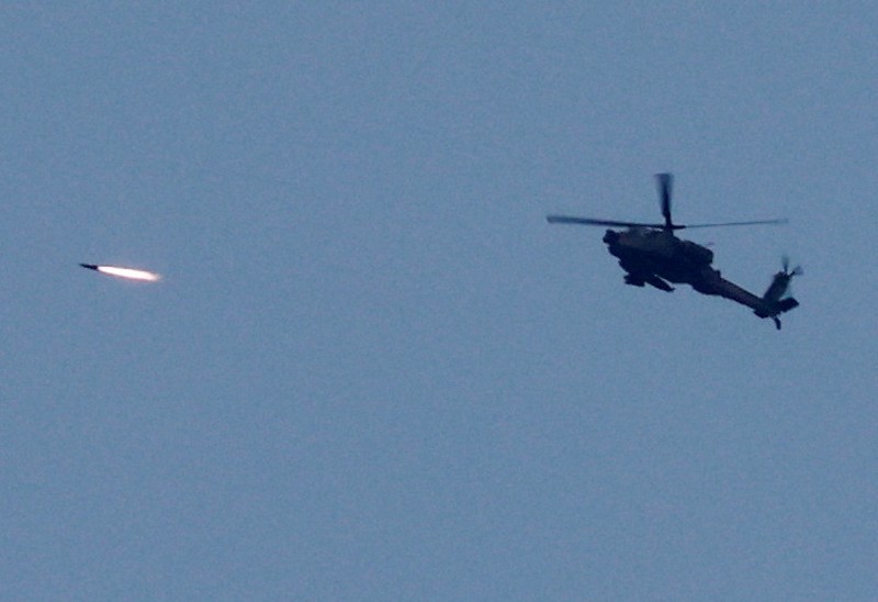 ISRAEL-PALESTINIANS/GAZA BORDER An Apache helicopter fires, amid the ongoing conflict between Israel and Palestinian Islamist group Hamas, as seen from Sderot in southern Israel, November 1, 2023. REUTERS/Ammar Awad