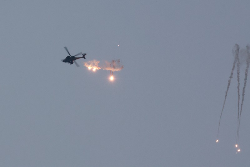 ISRAEL-PALESTINIANS/GAZA BORDER An Apache helicopter fires, amid the ongoing conflict between Israel and Palestinian Islamist group Hamas, as seen from Sderot in southern Israel, November 1, 2023. REUTERS/Ammar Awad