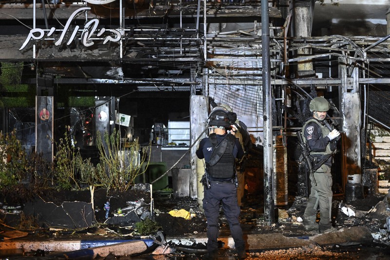 Israeli police investigate the scene of a rocket attack from Lebanon in Kiryat Shmona, northern Israel, Thursday, Nov. 2, 2023. (AP Photo/Rami Shllush)
