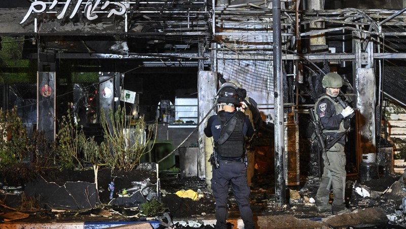Israeli police investigate the scene of a rocket attack from Lebanon in Kiryat Shmona, northern Israel, Thursday, Nov. 2, 2023. (AP Photo/Rami Shllush)
