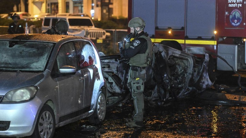 Israeli police investigate the scene of a rocket attack from Lebanon in Kiryat Shmona, northern Israel, Thursday, Nov. 2, 2023. (AP Photo/Rami Shllush)