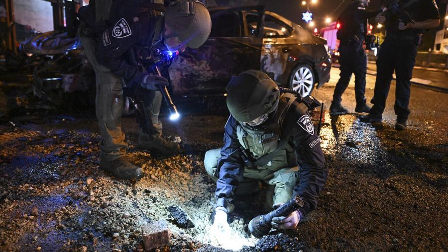 Israeli police investigate the scene of a rocket attack from Lebanon in Kiryat Shmona, northern Israel, Thursday, Nov. 2, 2023. (AP Photo/Rami Shllush)