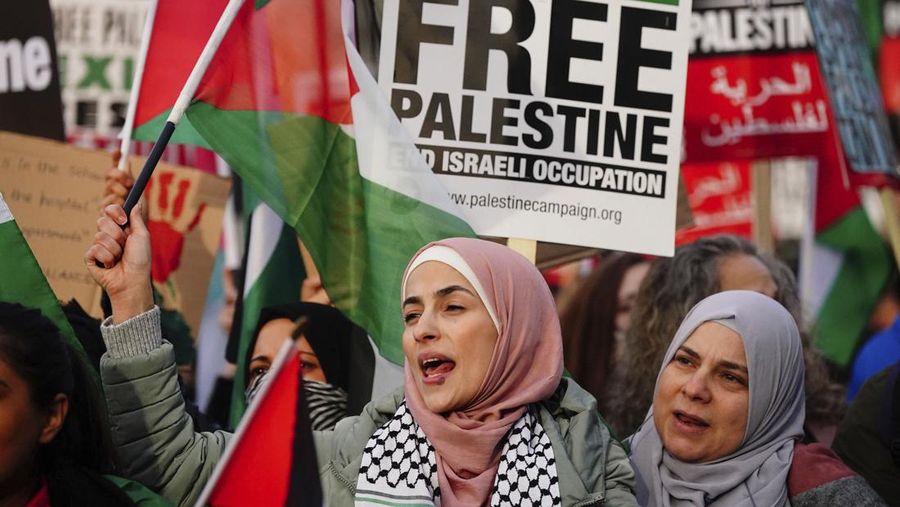 People take part in a pro Palestinian rally in Trafalgar Square, London, Saturday, Nov. 4, 2023. (Victoria Jones/PA via AP)