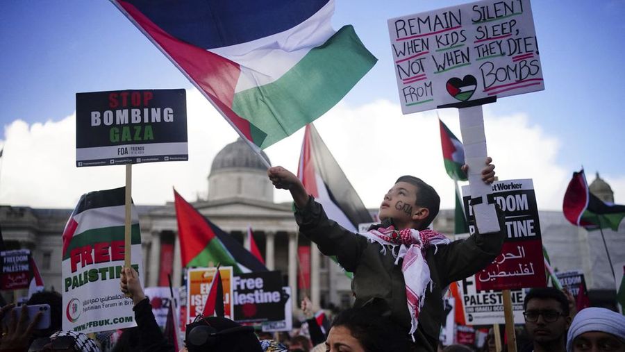 People take part in a pro Palestinian rally in Trafalgar Square, London, Saturday, Nov. 4, 2023. (Victoria Jones/PA via AP)