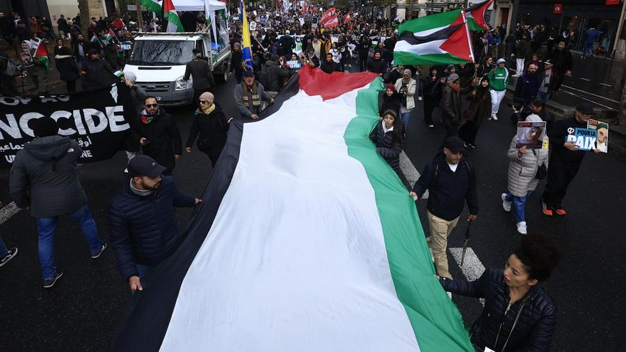 People take part in a pro Palestinian rally in Trafalgar Square, London, Saturday, Nov. 4, 2023. (Victoria Jones/PA via AP)