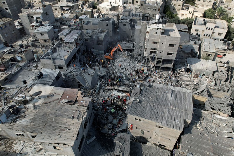 Israel Palestinians Palestinians look for survivors of the Israeli bombardment in the Maghazi refugee camp in the Gaza Strip on Sunday, Nov. 5, 2023. (AP Photo/Hatem Moussa)