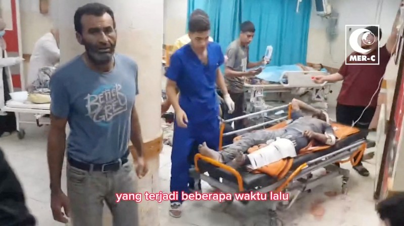 ISRAEL-PALESTINIANS/GAZA-INDONESIA HOSPITAL SENSITIVE MATERIAL. THIS IMAGE MAY OFFEND OR DISTURB A doctor examines a child in a hospital, amid the ongoing conflict between Israel and Palestinian Islamist group Hamas in Beit Lahiya, Gaza in this screengrab obtained from a social media video released on November 1, 2023. Mer-C/via REUTERS THIS IMAGE HAS BEEN SUPPLIED BY A THIRD PARTY. MANDATORY CREDIT.