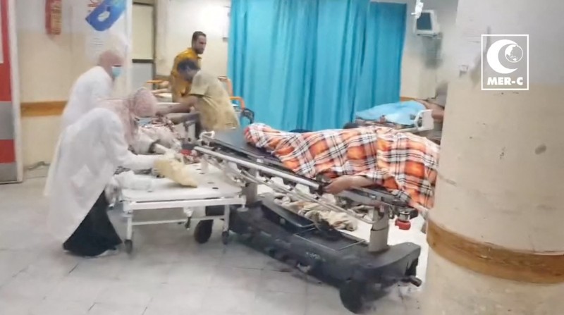 ISRAEL-PALESTINIANS/GAZA-INDONESIA HOSPITAL SENSITIVE MATERIAL. THIS IMAGE MAY OFFEND OR DISTURB A doctor examines a child in a hospital, amid the ongoing conflict between Israel and Palestinian Islamist group Hamas in Beit Lahiya, Gaza in this screengrab obtained from a social media video released on November 1, 2023. Mer-C/via REUTERS THIS IMAGE HAS BEEN SUPPLIED BY A THIRD PARTY. MANDATORY CREDIT.