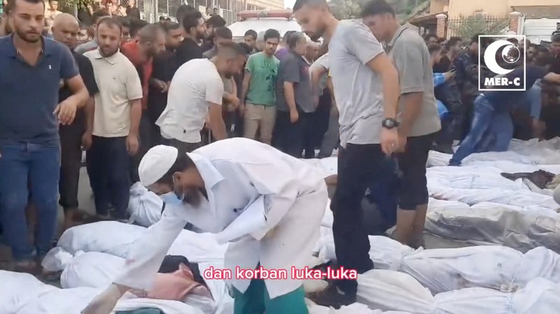 ISRAEL-PALESTINIANS/GAZA-INDONESIA HOSPITAL SENSITIVE MATERIAL. THIS IMAGE MAY OFFEND OR DISTURB A doctor examines a child in a hospital, amid the ongoing conflict between Israel and Palestinian Islamist group Hamas in Beit Lahiya, Gaza in this screengrab obtained from a social media video released on November 1, 2023. Mer-C/via REUTERS THIS IMAGE HAS BEEN SUPPLIED BY A THIRD PARTY. MANDATORY CREDIT.