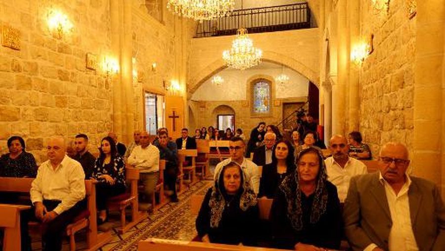Palestinian christians attend mass on October 23, 2023, for those killed during a strike on the Greek Orthdox church of Saint Porphyrius in Gaza City on October 20, in the village of Jifna, north of Ramallah in the occupied West Bank amid ongoing battles between Israel and the Palestinian militant group Hamas. (Photo by Jaafar ASHTIYEH / AFP)