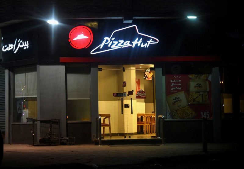 A worker walks inside an empty McDonald's restaurant as a result of the boycott of Western brands in Egypt due to the Israeli bombardment in Gaza amid the ongoing conflict between Israel and the Palestinian Islamist group Hamas, in Cairo, Egypt, November 20, 2023. REUTERS/Mohamed Abd El Ghany