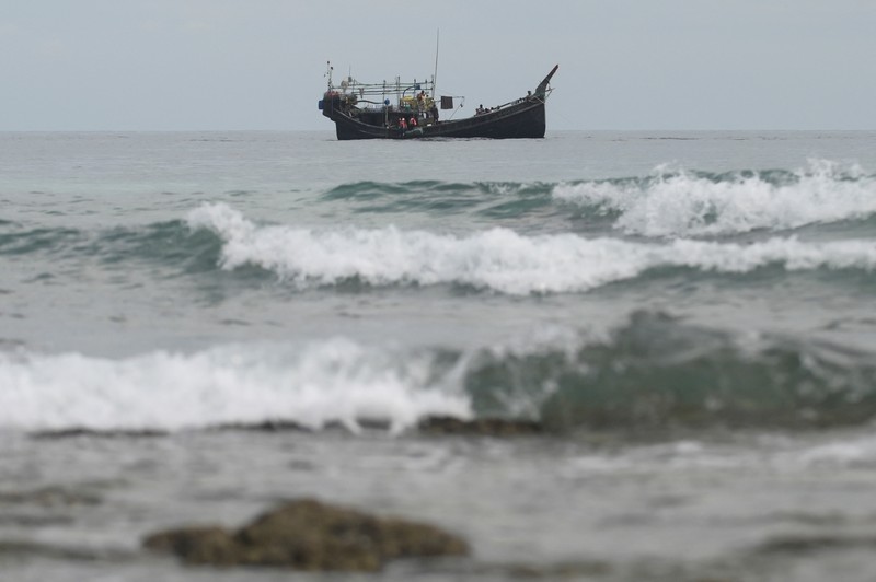 A wooden boat that carried Rohingya Muslims is seen off the coast in Sabang, Aceh province, Indonesia, November 22, 2023. REUTERS/Riska Munawarah