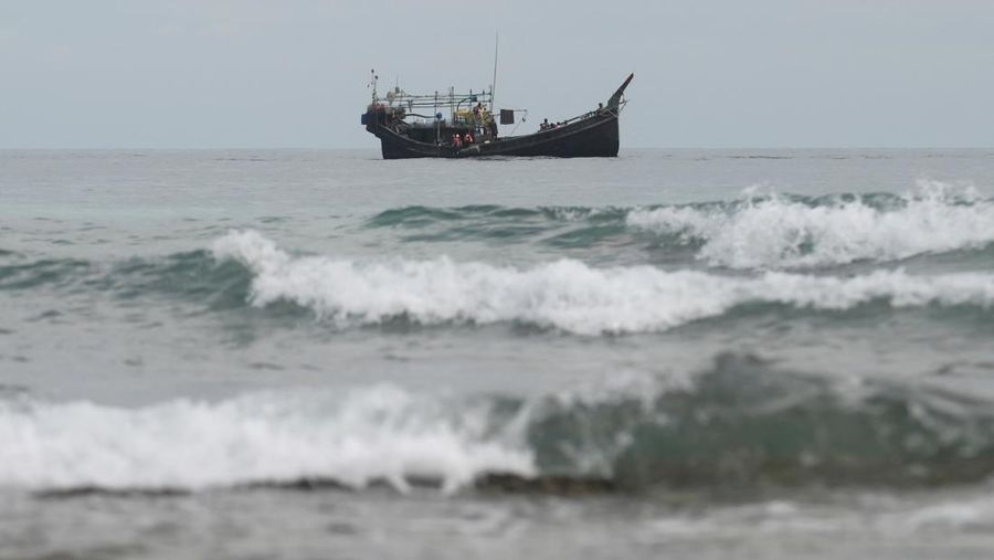 A wooden boat that carried Rohingya Muslims is seen off the coast in Sabang, Aceh province, Indonesia, November 22, 2023. REUTERS/Riska Munawarah