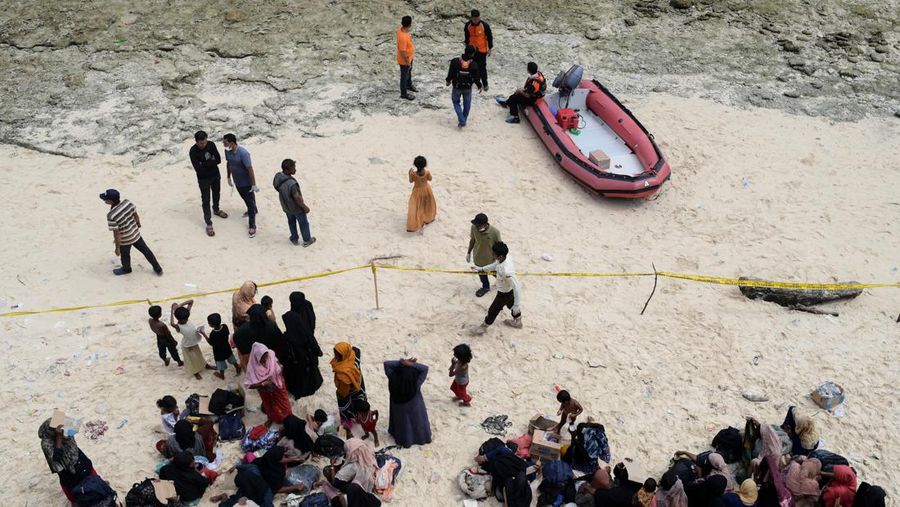 A wooden boat that carried Rohingya Muslims is seen off the coast in Sabang, Aceh province, Indonesia, November 22, 2023. REUTERS/Riska Munawarah