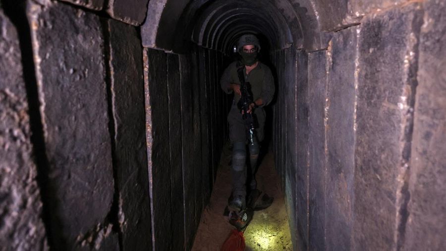 An Israeli soldier walks through a tunnel underneath Al Shifa Hospital in Gaza City, amid the ongoing ground operation of the Israeli army against Palestinian Islamist group Hamas, in the northern Gaza Strip, November 22, 2023. REUTERS/Ronen Zvulun  EDITOR'S NOTE: REUTERS PHOTOGRAPHS WERE REVIEWED BY THE IDF AS PART OF THE CONDITIONS OF THE EMBED. NO PHOTOS WERE REMOVED.     TPX IMAGES OF THE DAY