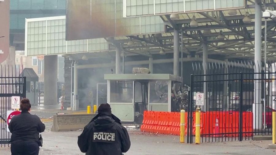 Police officers view the scene after an incident at the Rainbow Bridge U.S. border crossing with Canada, in Niagara Falls, New York, U.S. November 22, 2023 in a still image from video.  REUTERS/Reuters TV