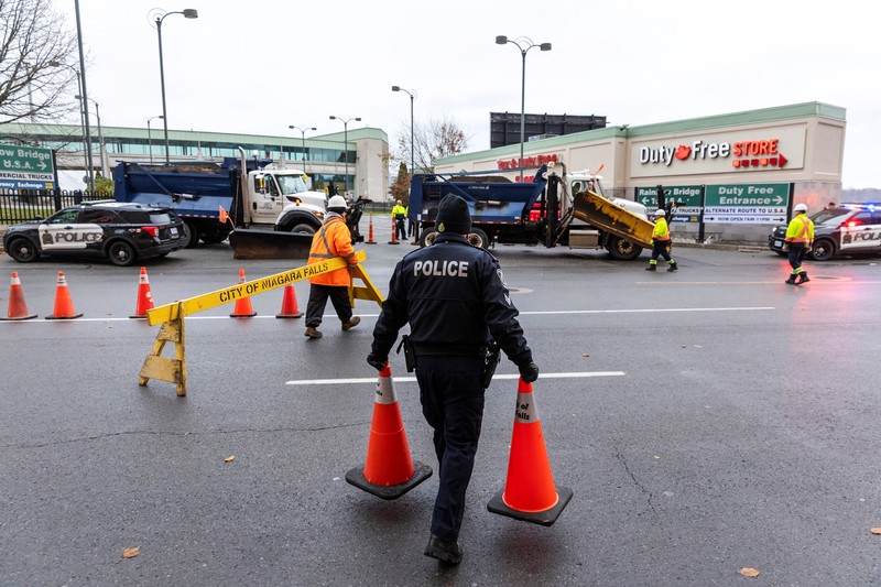 Police officers view the scene after an incident at the Rainbow Bridge U.S. border crossing with Canada, in Niagara Falls, New York, U.S. November 22, 2023 in a still image from video.  REUTERS/Reuters TV