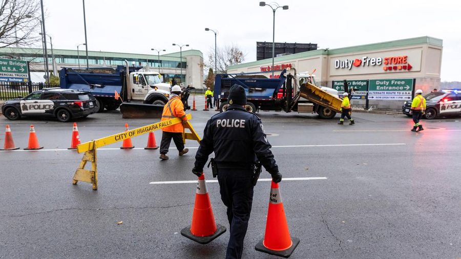 Police officers view the scene after an incident at the Rainbow Bridge U.S. border crossing with Canada, in Niagara Falls, New York, U.S. November 22, 2023 in a still image from video.  REUTERS/Reuters TV