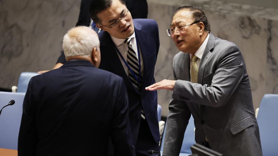 NEW YORK, NEW YORK - NOVEMBER 22: Palestinian Permanent Observer to the United Nations Riyad H. Mansour speaks with Permanent Representative of China to the United Nations and president of the Security Council for the month of November Zhang Jun during a UN Security Council meeting on the situation in the Middle East, and the Israel-Hamas war at the United Nations headquarters on November 22, 2023 in New York City. The Security Council met amid a four day pause in fighting between Israel and Hamas that would let in aid and release at least 50 hostages captured by the militants in exchange for at least 150 Palestinians jailed in Israel. Israel has said that the pause could be extended further, as long as more hostages were freed. (Photo by Michael M. Santiago/Getty Images)