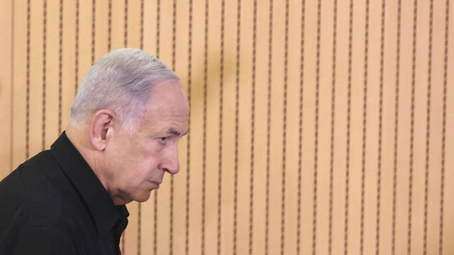 Israeli Prime Minister Benjamin Netanyahu attends a press conference with Defense Minister Yoav Gallant and Cabinet Minister Benny Gantz in the Kirya military base in Tel Aviv, Israel, Saturday, Oct. 28, 2023. (Abir Sultan/Pool Photo via AP)