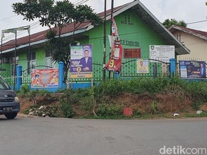 Poster Caleg Bertebaran di Pagar Sekolah di Palembang