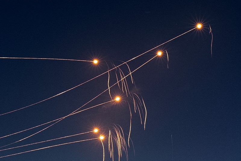 ISRAEL-PALESTINIANS/ Israel's Iron Dome anti-missile system intercepts rockets launched from the Gaza Strip, after a temporary truce between Israel and the Palestinian Islamist group Hamas expired, as seen from Ashkelon, Israel, December 1, 2023. REUTERS/Amir Cohen TPX IMAGES OF THE DAY