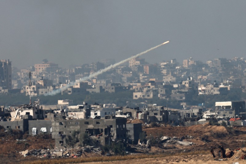An Israeli military helicopter releases a flare over the Israel-Gaza border, after a temporary truce between Israel and the Palestinian Islamist group Hamas expired, as seen from southern Israel, December 1, 2023. REUTERS/Amir Cohen     TPX IMAGES OF THE DAY