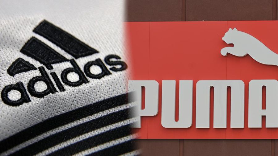 Foto kolase logo Adidas dan Puma. (REUTERS & Nur Photo via Getty Images)