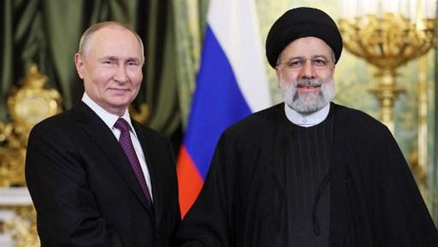 In this pool photograph distributed by Russian news agency Sputnik on December 7, 2023, Russia's President Vladimir Putin (L) shakes hands with Iran's President Ebrahim Raisi during their meeting in the Kremlin in Moscow. (Photo by Sergei BOBYLYOV / POOL / AFP) / Editor's note : this image is distributed by Russian state owned agency Sputnik
