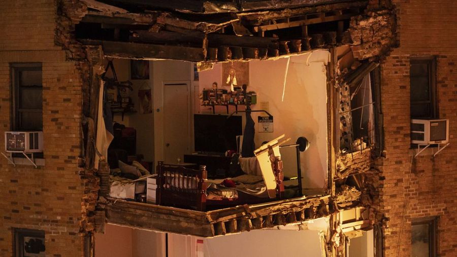 Debris piles up after a building collapsed in the Bronx borough of New York, Monday, Dec. 11, 2023. (AP Photo/Yuki Iwamura)