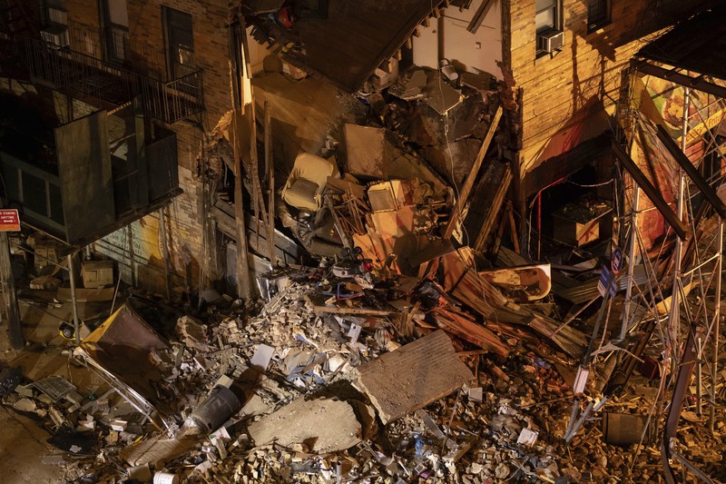 Building Collapse Bronx Debris piles up after a building collapsed in the Bronx borough of New York, Monday, Dec. 11, 2023. (AP Photo/Yuki Iwamura)