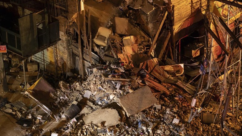 Debris piles up after a building collapsed in the Bronx borough of New York, Monday, Dec. 11, 2023. (AP Photo/Yuki Iwamura)