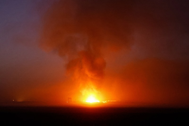ISRAEL-PALESTINIANS/ Smoke and debris rises over Gaza, amid the ongoing conflict between Israel and the Palestinian Islamist group Hamas, as seen from southern Israel, December 11, 2023. REUTERS/Clodagh Kilcoyne