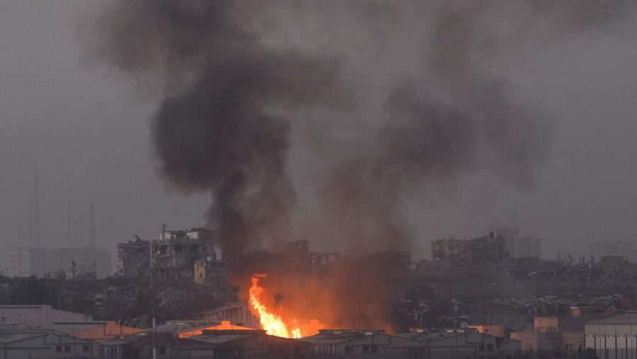 Fire burns inside central Gaza strip following an airstrike, amid the ongoing conflict between Israel and the Palestinian Islamist group Hamas, as seen from southern Israel, December 11, 2023. REUTERS/Amir Cohen