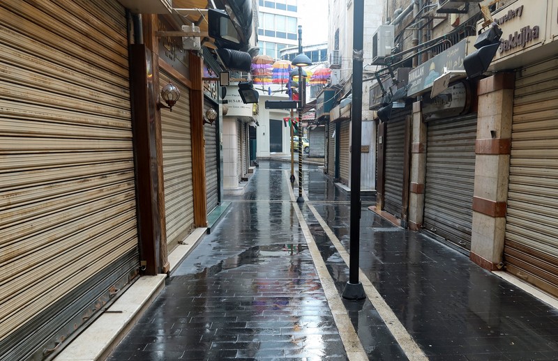 A view shows an empty street with closed shops in response to a global call for a strike in solidarity with Palestinians in Gaza, in Amman, Jordan December 11, 2023. REUTERS/Jehad Shelbak