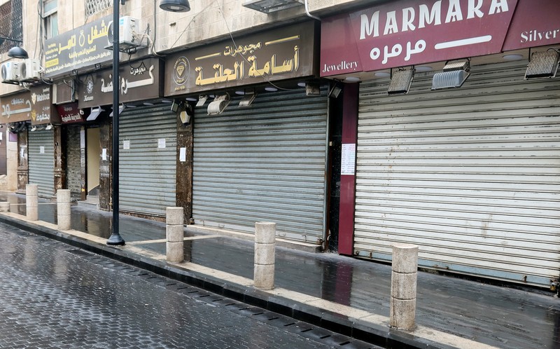 A view shows an empty street with closed shops in response to a global call for a strike in solidarity with Palestinians in Gaza, in Amman, Jordan December 11, 2023. REUTERS/Jehad Shelbak
