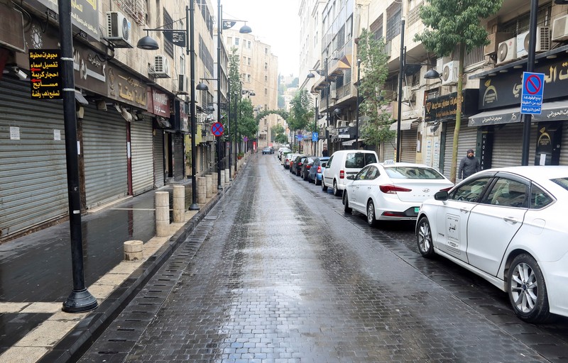 A view shows an empty street with closed shops in response to a global call for a strike in solidarity with Palestinians in Gaza, in Amman, Jordan December 11, 2023. REUTERS/Jehad Shelbak