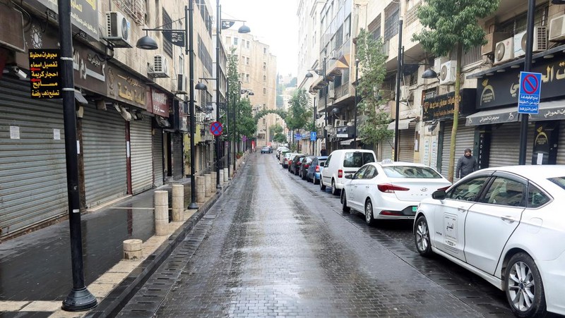 A view shows an empty street with closed shops in response to a global call for a strike in solidarity with Palestinians in Gaza, in Amman, Jordan December 11, 2023. REUTERS/Jehad Shelbak