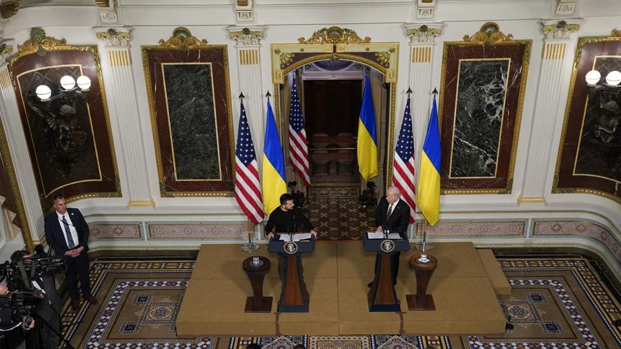Ukrainian President Volodymyr Zelenskyy speaks during a news conference with President Joe Biden in the Indian Treaty Room in the Eisenhower Executive Office Building on the White House Campus, Tuesday, Dec. 12, 2023, in Washington. (AP Photo/Evan Vucci)