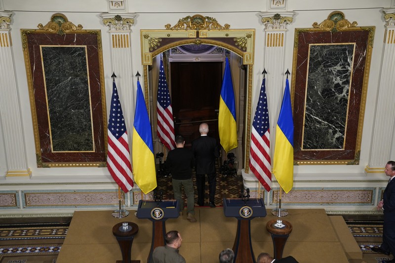 Biden US Ukraine Ukrainian President Volodymyr Zelenskyy speaks during a news conference with President Joe Biden in the Indian Treaty Room in the Eisenhower Executive Office Building on the White House Campus, Tuesday, Dec. 12, 2023, in Washington. (AP Photo/Evan Vucci)