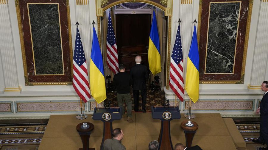 Ukrainian President Volodymyr Zelenskyy speaks during a news conference with President Joe Biden in the Indian Treaty Room in the Eisenhower Executive Office Building on the White House Campus, Tuesday, Dec. 12, 2023, in Washington. (AP Photo/Evan Vucci)