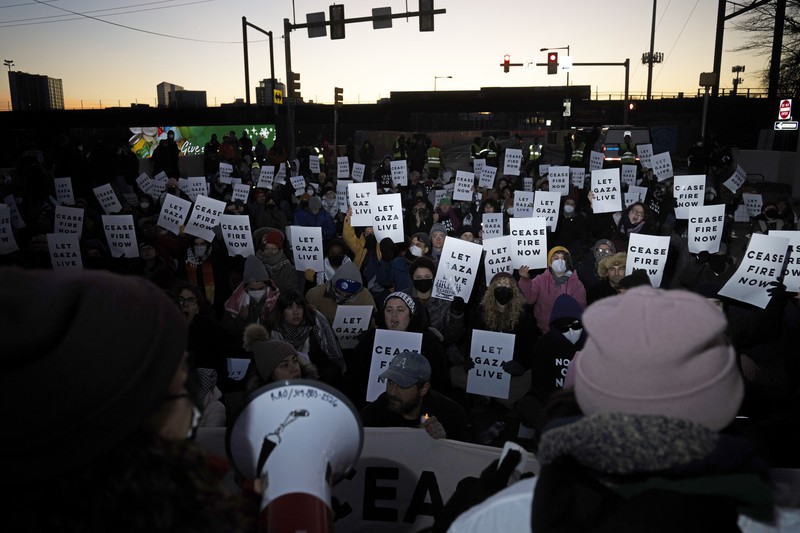 US Israel Palestinians Protestors calling for a ceasefire in the Israel-Hamas war block traffic on New York Avenue NW in Washington, Thursday, Dec. 14, 2023. (AP Photo/Stephanie Scarbrough)