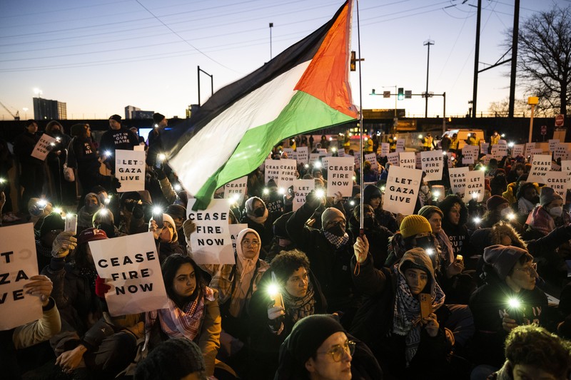 US Israel Palestinians Protestors calling for a ceasefire in the Israel-Hamas war block traffic on New York Avenue NW in Washington, Thursday, Dec. 14, 2023. (AP Photo/Stephanie Scarbrough)