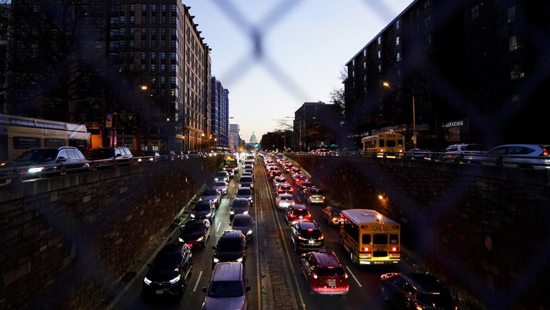 Protestors calling for a ceasefire in the Israel-Hamas war block traffic on New York Avenue NW in Washington, Thursday, Dec. 14, 2023. (AP Photo/Stephanie Scarbrough)