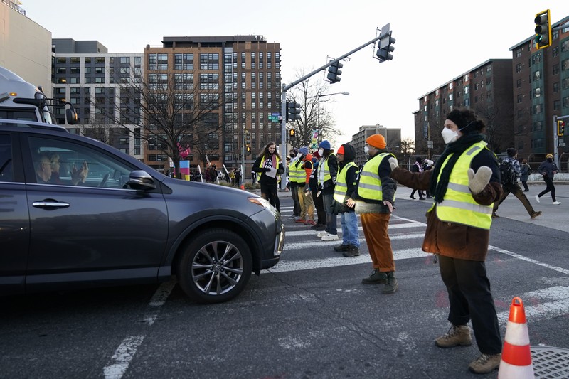 US Israel Palestinians Protestors calling for a ceasefire in the Israel-Hamas war block traffic on New York Avenue NW in Washington, Thursday, Dec. 14, 2023. (AP Photo/Stephanie Scarbrough)