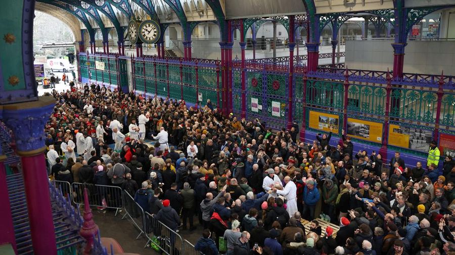 A butcher gathers meat cuts before a a pre-Christmas meat auction held by G Lawrence butchers at Smithfield Market in London, Britain, December 23, 2023. REUTERS/Toby Melville