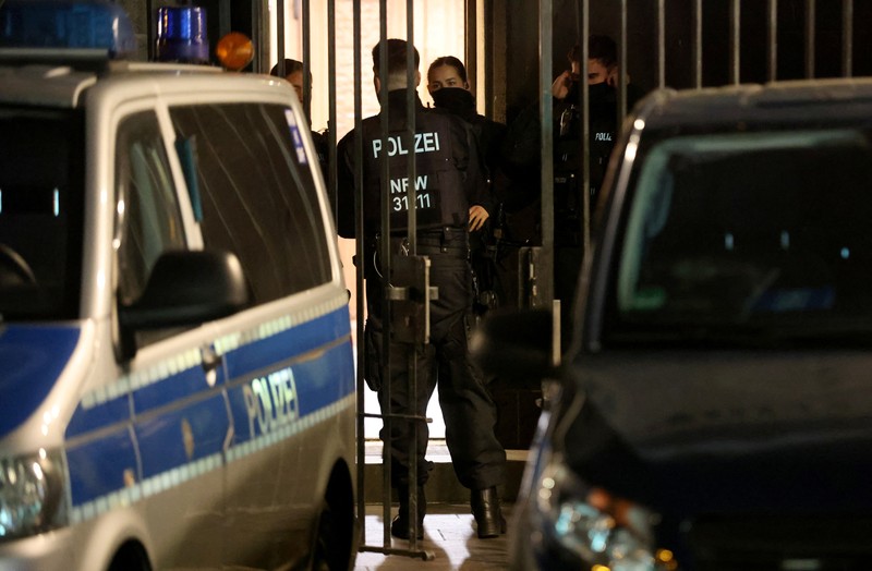 German police walk in front of the cathedral in central Cologne, Germany, December 23, 2023.     REUTERS/Thilo Schmuelgen